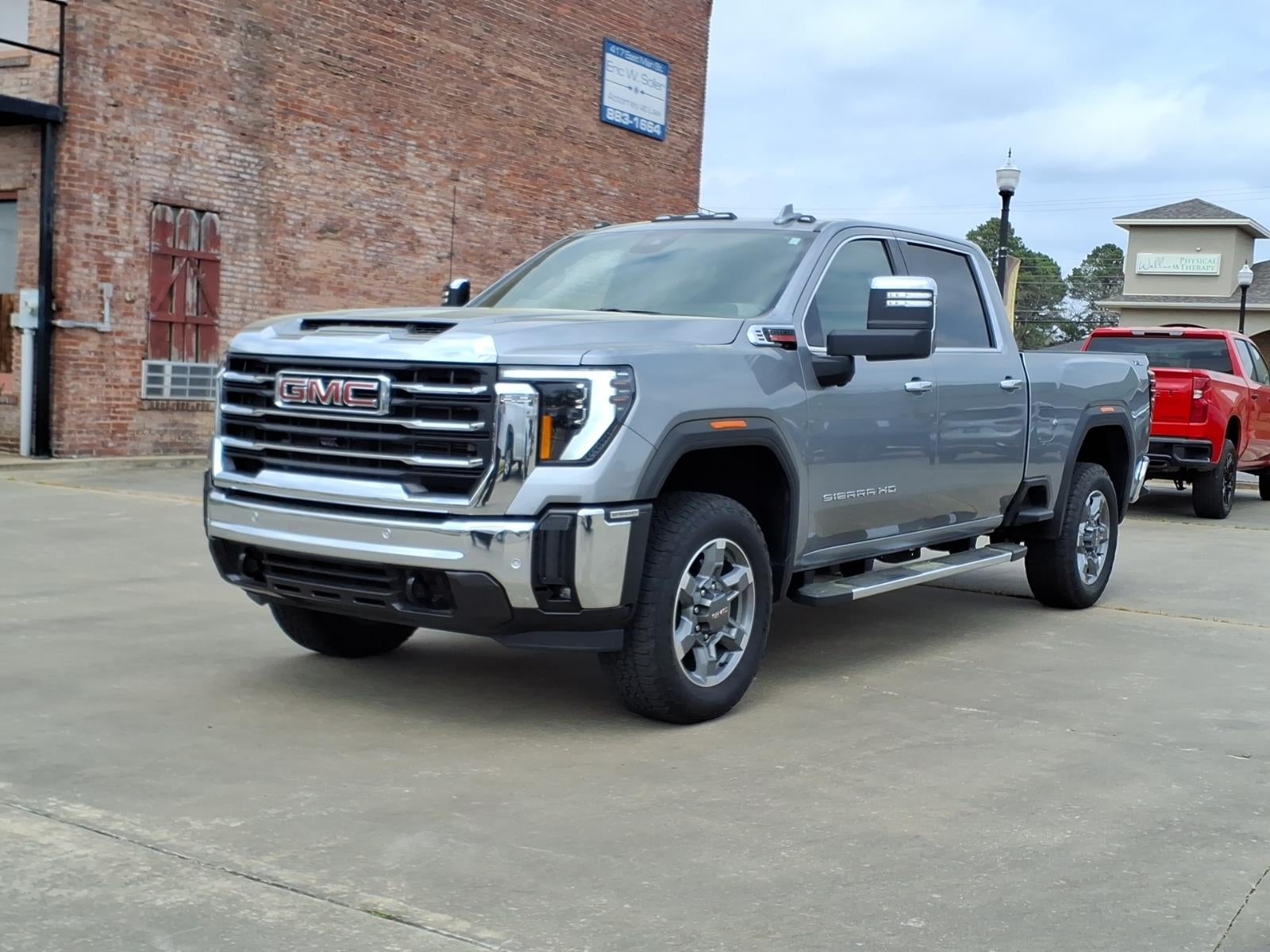 2025 GMC Sierra 2500 HD SLT in Sterling Metallic — front three-quarter view
